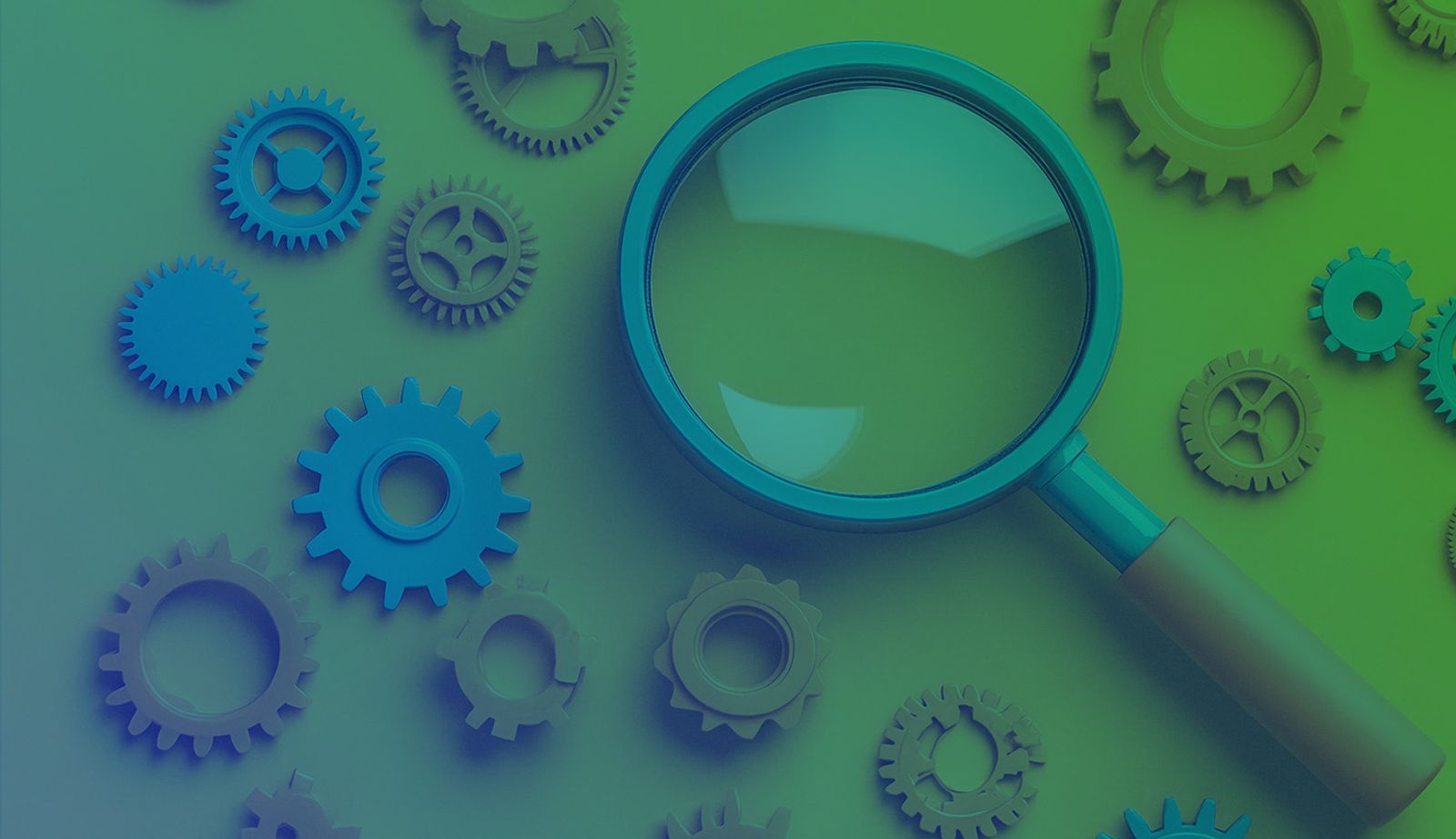 Stock image of gears and a magnifying glass.